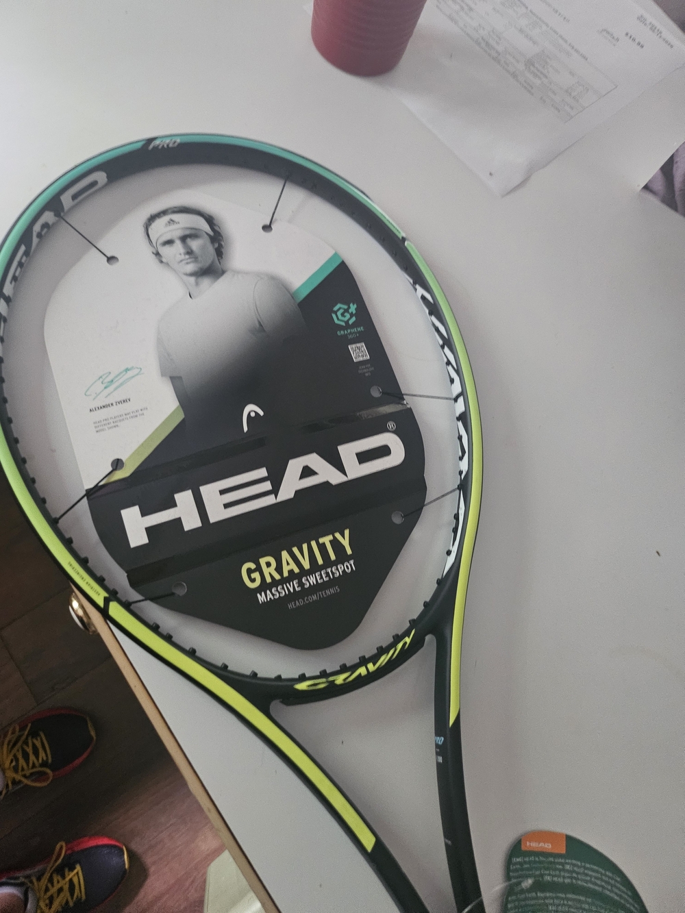 Head Gravity Tennis Racket in Black and Neon Green Grip 4 1/4